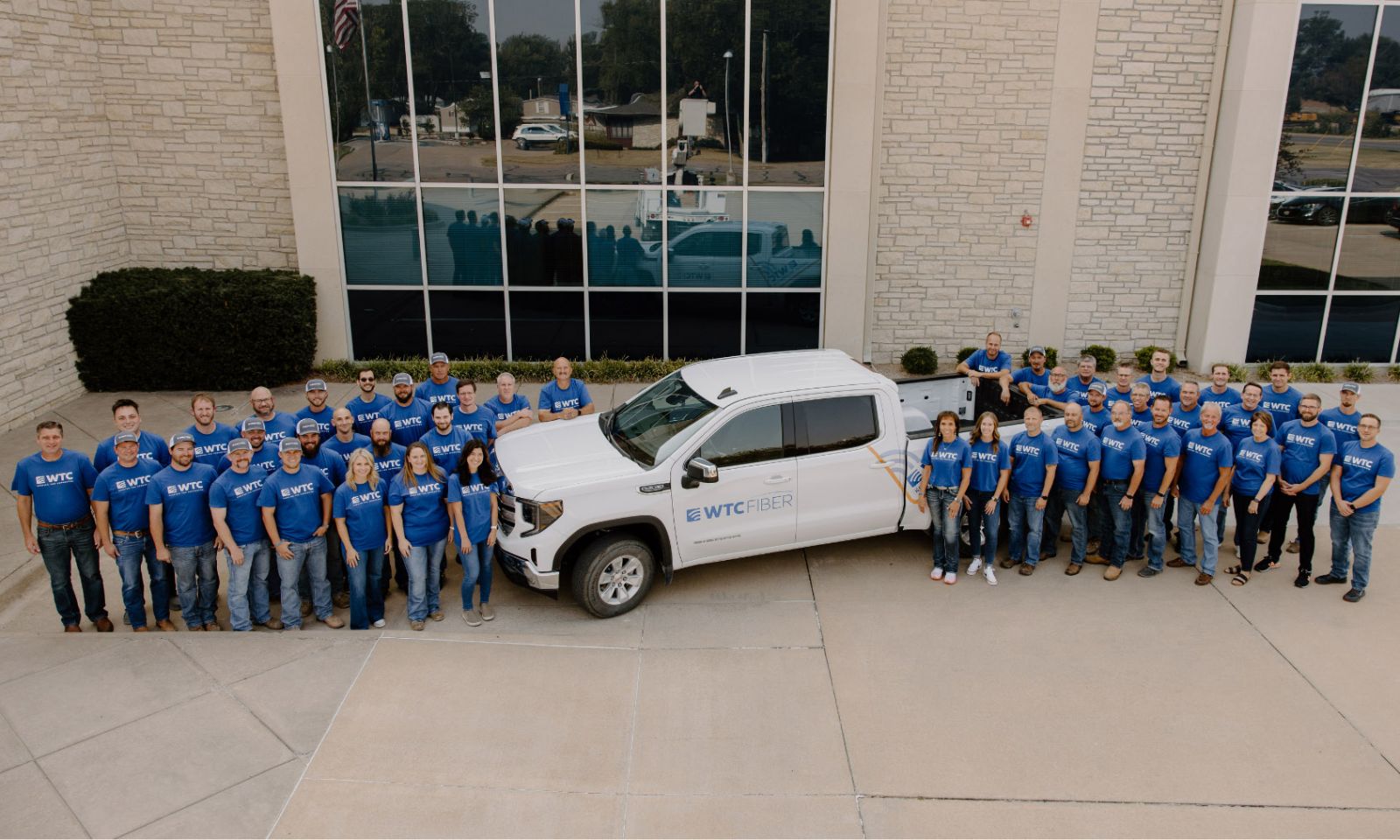 All WTC employees standing by a WTC truck