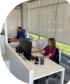 WTC employees sitting in an office scheduling